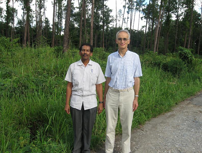 28 Land f.jpg - Michael McKenzie, Director of Architecture, with Raja Graham on beautiful land the Movement is hoping to acquire. The land could be used for a Maharishi Invincibility School and a Tower of Invincibility.